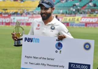 Jadeja poses in front of camera with 'man of the... Jadeja poses in front of camera with 'man of the...