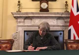 Theresa May signs the letter triggering Article... Theresa May signs the letter triggering Article...