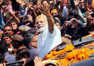 PM Narendra Modi during a road show in Varanasi ... PM Narendra Modi during a road show in Varanasi ...
