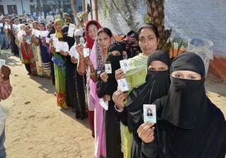 Women line up at a polling booth in Varanasi... Women line up at a polling booth in Varanasi...