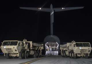 Trucks carrying missile launchers and other... Trucks carrying missile launchers and other...