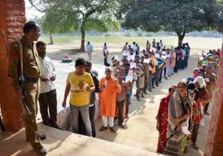 People at a polling booth to cast their vote in... People at a polling booth to cast their vote in...