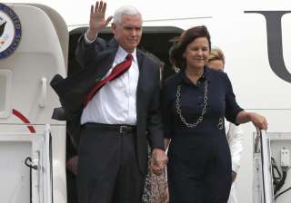 Mike Pence with his wife Karen arrive at US... Mike Pence with his wife Karen arrive at US...