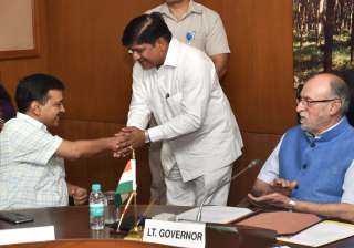 LG Baijal looks on as Kejriwal greets newly... LG Baijal looks on as Kejriwal greets newly...