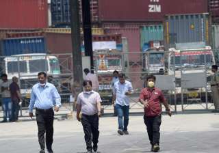 NDRF members during the clean-up operation at a... NDRF members during the clean-up operation at a...