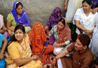 Minister Kavita Jain meeting family members of... Minister Kavita Jain meeting family members of...