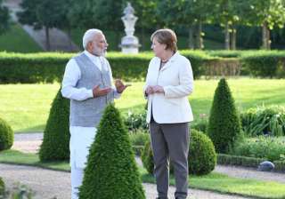 Modi met Merkel at her country retreat near... Modi met Merkel at her country retreat near...