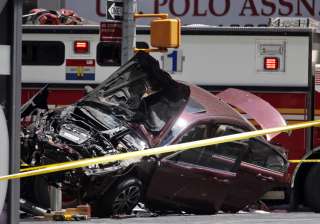 One killed as car drives into crowd in New... One killed as car drives into crowd in New...