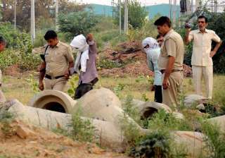 Rohtak: Police, with the accused, inspecting the... Rohtak: Police, with the accused, inspecting the...
