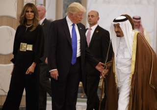 Trump and Melania walk with Saudi King Salman to... Trump and Melania walk with Saudi King Salman to...