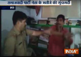 Samajwadi Party leader's nephew assaults cop... Samajwadi Party leader's nephew assaults cop...