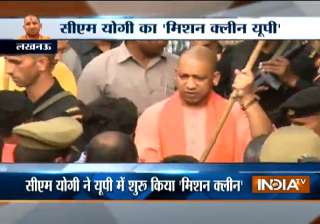 Yogi Adityanath wielding broom - India TV Yogi Adityanath wielding broom - India TV