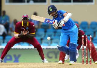 Ajinkya Rahane of India plays the ball during the... Ajinkya Rahane of India plays the ball during the...