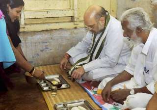 Amit Shah having breakfast at residence of a... Amit Shah having breakfast at residence of a...