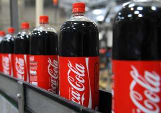 Aerated drinks like Coke will be taxed at 40 per... Aerated drinks like Coke will be taxed at 40 per...