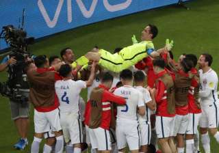 Chile players celebrate their win against... Chile players celebrate their win against...