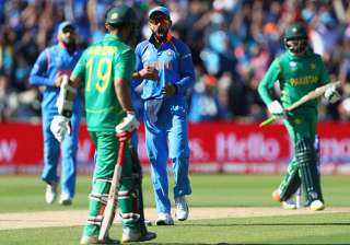 Virat Kohli on action during the match against... Virat Kohli on action during the match against...