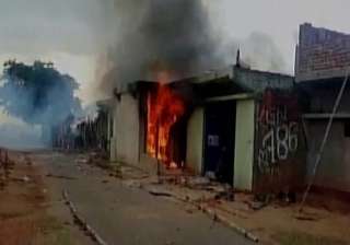 Man thrashed, house set on fire by mob on... Man thrashed, house set on fire by mob on...