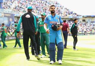 Virat Kohli celebrates the victory against... Virat Kohli celebrates the victory against...