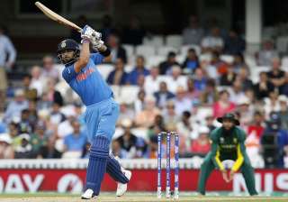 Virat Kohli plays a shot during the game against... Virat Kohli plays a shot during the game against...
