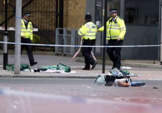 Police patrol nears bags of evidence collected in... Police patrol nears bags of evidence collected in...
