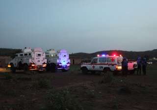 UN armored personnel vehicles stationed with an... UN armored personnel vehicles stationed with an...