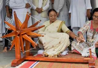 Meira Kumar tries her hand on a spinning wheel... Meira Kumar tries her hand on a spinning wheel...