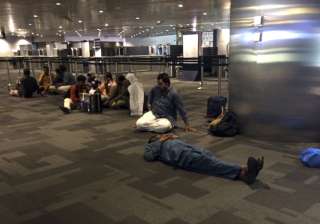 Passengers of cancelled flights wait at Doha... Passengers of cancelled flights wait at Doha...