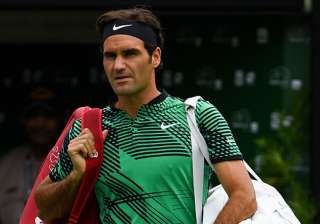 Roger Federer of Switzerland walks onto the court... Roger Federer of Switzerland walks onto the court...