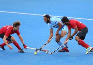 Sardar Singh of India battles for possession with... Sardar Singh of India battles for possession with...