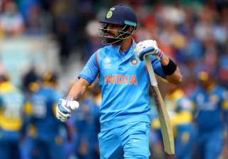 Virat Kohli of India leaves the field after being... Virat Kohli of India leaves the field after being...
