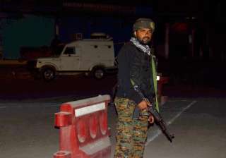 Security person stand guard after militants... Security person stand guard after militants...