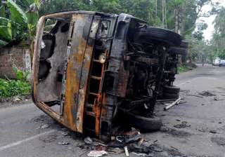 A burnt vehicle seen at a road after a communal... A burnt vehicle seen at a road after a communal...