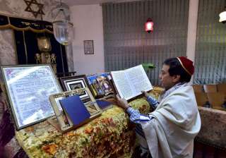Priest Ezekiel Markel reads religious books at... Priest Ezekiel Markel reads religious books at...
