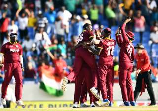Jason Holder celebrates with teammates after... Jason Holder celebrates with teammates after...