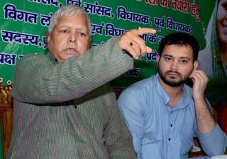 Lalu Prasad addressing a press conference with... Lalu Prasad addressing a press conference with...