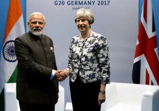 PM Modi meets Theresa May in Germany - India TV PM Modi meets Theresa May in Germany - India TV