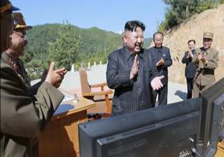 File pic -Kim Jung Un applauding after... File pic -Kim Jung Un applauding after...