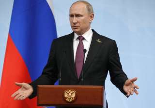Putin gestures during a press conference after... Putin gestures during a press conference after...