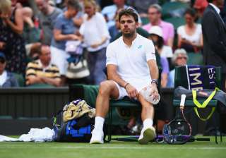 Stan Wawrinka of Switzerland puts ice on his knee... Stan Wawrinka of Switzerland puts ice on his knee...