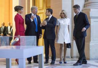 Trump, Macron and their wives chatting after... Trump, Macron and their wives chatting after...