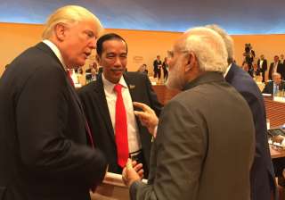 Trump walks up to Modi for 'impromptu' chat at... Trump walks up to Modi for 'impromptu' chat at...