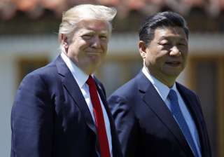 File pic - Trump and Jinping walk together after... File pic - Trump and Jinping walk together after...