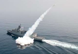 A South Korean navy ship fires a missile during... A South Korean navy ship fires a missile during...