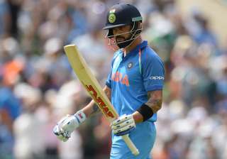 Virat Kohli of India leaves the field after being... Virat Kohli of India leaves the field after being...