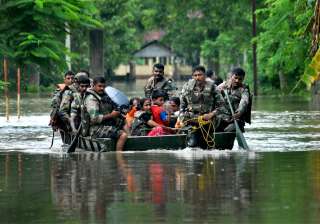 Army soldiers rescuing people from floods Army soldiers rescuing people from floods