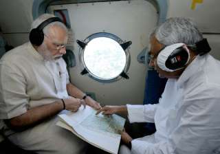 PM Modi conducts aerial survey of flood-hit... PM Modi conducts aerial survey of flood-hit...