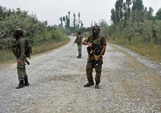 Pulwama: Army personnel stand guard during a gun... Pulwama: Army personnel stand guard during a gun...