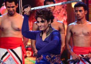 raveena tandon tries her hand at sword stunts -... raveena tandon tries her hand at sword stunts -...