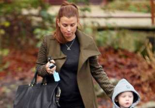 coleen rooney protecting house from spider by... coleen rooney protecting house from spider by...